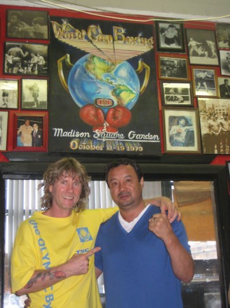 Serik Konakbaev under the Poster from 1979 World Boxing CUP that he won.